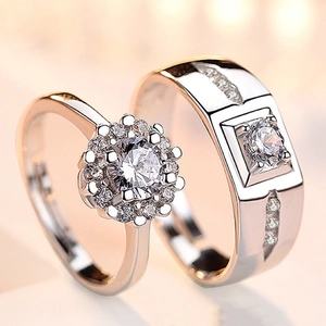 Detailed close-up of silver and rose gold plated couple rings with sparkling cubic zirconia