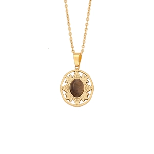 Vintage stainless steel necklace with round sunburst pendant and oval tiger eye stone