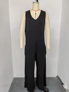 Close-up of black sleeveless V-neck jumpsuit with side pockets and wide-leg cut