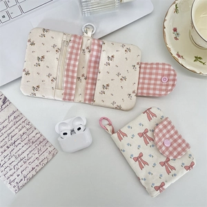 Floral fabric pouches with pink bows and snap button closure for cards and coins