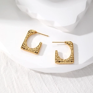 Irregular vintage gold-tone stainless steel hoop earrings with hammered texture