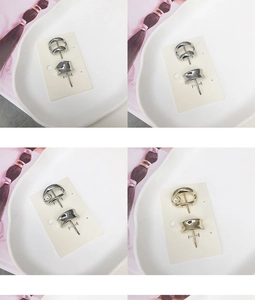 Detail of irregular geometric metal hair clips and earrings with pearls in gold and silver