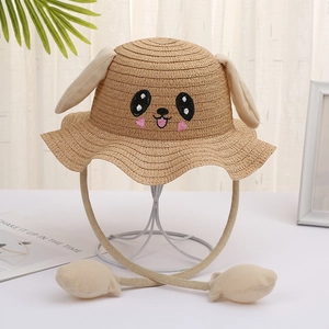 Close-up of cute puppy embroidery and movable ears on kids summer straw sun hat