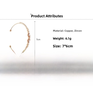 Detail view of rose gold copper bangle with sparkling heart and round zircon stones