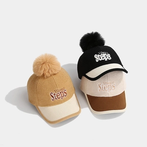 Kids wool baseball caps with Vibrant Steps embroidery and plush pom-poms in three colors