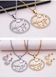 Macro detail of bird jewelry set with crystal circular pendant and matching earrings