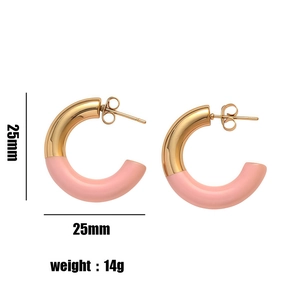 Minimalist C-shaped 25mm gold and pink hoop earrings with a modern matte finish