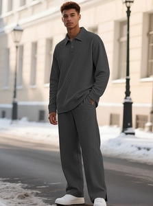 Men's dark gray long sleeve polo set with waffle texture and wide-leg trousers outdoors