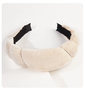 Close-up of beige velvet sponge headband with premium braided texture and padded design