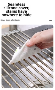 Detail of seamless silicone-coated foldable sink drying rack being wiped clean easily