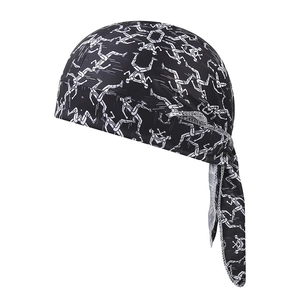 Detailed view of paisley print cycling cap with adjustable ties and breathable fabric
