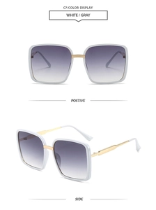 Detalle de gafas de sol cuadradas blancas con lentes degradadas grises y patillas doradas
