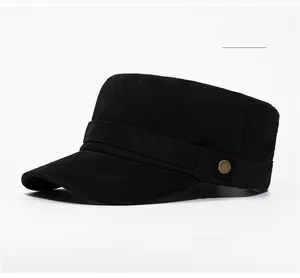 Detail shot of a black washed cotton military flat top hat with vintage bronze button decor