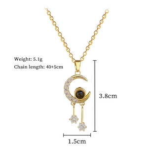 Detailed view of crescent moon and star necklace with dimensions and 5.1g weight info