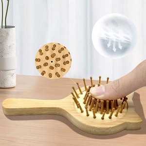 Cat-shaped bamboo massage hair brush with ergonomic handle and soft air cushion base
