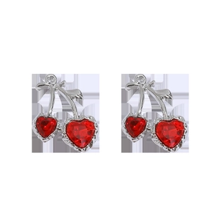 Detail of silver cherry charms with red heart-shaped crystals for jewelry making