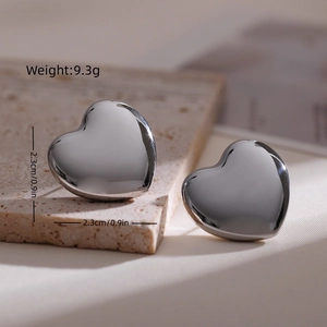 Detailed view of silver heart stud earrings with dimensions 2.3cm and 9.3g weight