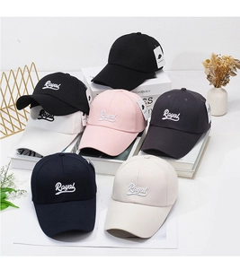 Detailed embroidery of Royal lettering on cotton baseball caps in multiple colors