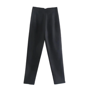 Detailed view of black high waisted trousers with high quality woven fabric texture