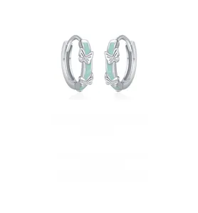 Detailed macro view of mint green enamel butterfly earrings crafted in S925 sterling silver