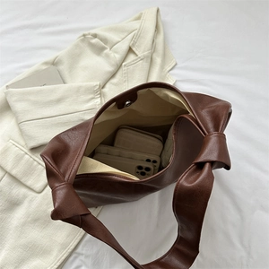Retro brown large capacity tote bag with decorative knot straps and magnetic closure