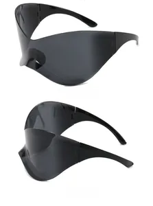 Detail view of all-black futuristic Y2K sunglasses with a seamless wrap-around frame design