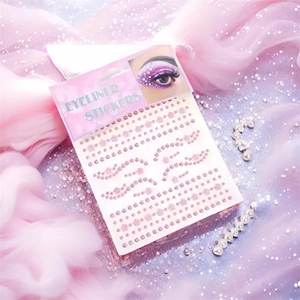 Pink rhinestone eyeliner stickers for eye decoration on a soft dreamy tulle background