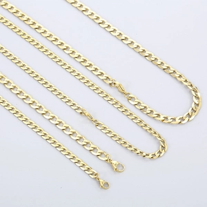 Macro detail of the vacuum-plated gold flat NK chain and clasp mechanism texture
