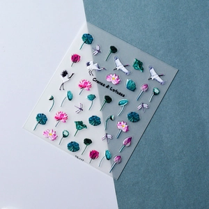 Detail of 3D embossed nail stickers featuring cranes and lotus flowers in ink wash style