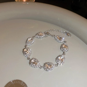 Detailed view of silver s925 pear-shaped cluster bracelet with sparkling zircons