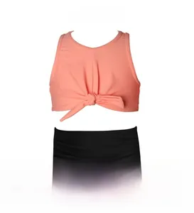 Detail of coral pink knotted top and black high-waisted bottoms for girls' bikini set