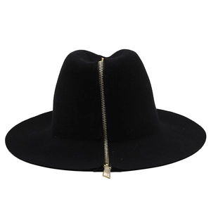 Close-up of the black wool fedora featuring a decorative gold vertical zipper detail