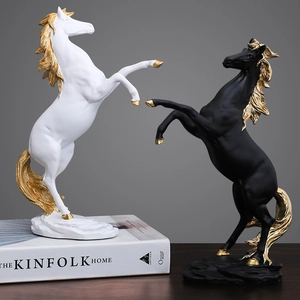 Modern horse sculptures in black and white with gold accents for elegant home decor