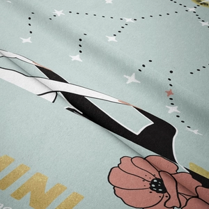 Macro detail showing soft velvet texture and Gemini constellation print with floral pattern