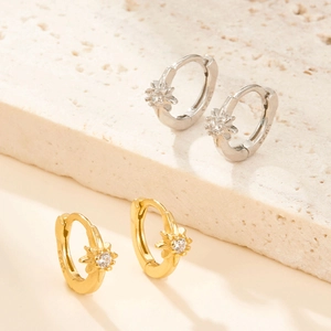 Close-up of S925 sterling silver star hoop earrings with sparkling zircon inlay