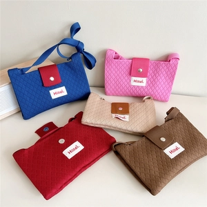 Five assorted knit crossbody bags with diamond texture and magnetic snap closures