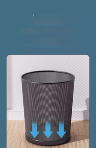 Detail of metal mesh trash can featuring a leak-proof solid base and durable steel wire frame