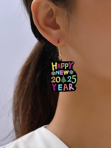 Close-up of model wearing Happy New 2025 Year earrings with snowflake and tree patterns