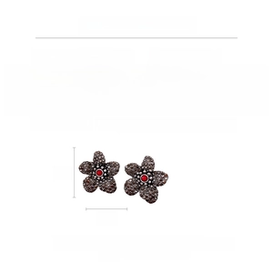 Detail view of vintage flower earrings with crystal inlay showing 3cm size and weight specs