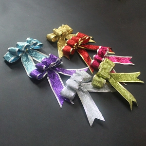 Sparkly Christmas glitter bows in various colors for festive tree and holiday mall decoration