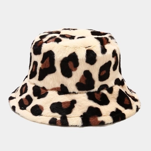 Detailed close-up of plush faux fur leopard print bucket hat for winter warmth