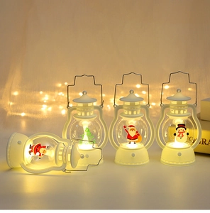Close-up of portable Christmas LED lanterns with Santa and snowman patterns in white