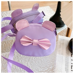 Detail view of purple cartoon cat bag with glittery bow and adjustable fabric shoulder strap