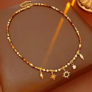 Bohemian tiger eye stone necklace with sun and star pendants on a premium leather base