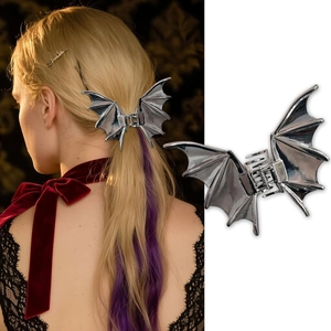 Detail view showing a silver metal bat hair claw clip on model and white background