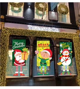 Detail view of festive Christmas hanging banners featuring Santa, Snowman and Elf characters