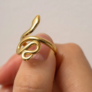 Macro detail of 18K gold plated stainless steel snake ring with textured serpent design