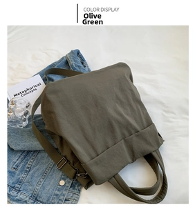 Detailed top view of an olive green nylon tote bag with adjustable shoulder strap