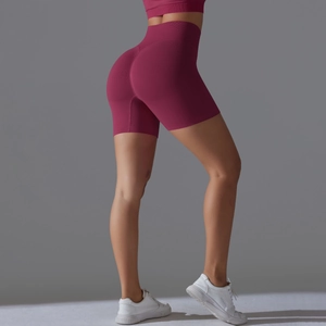 Close-up of scrunch butt detail on seamless high waist yoga shorts in magenta rib fabric
