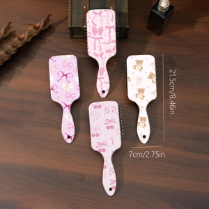 Spazzole per capelli con orsetti e fiocchi su sfondo in legno, misura 21,5x7cm